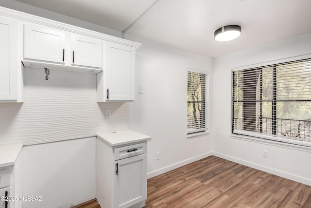 kitchen with white cabinets and light wood-type flooring