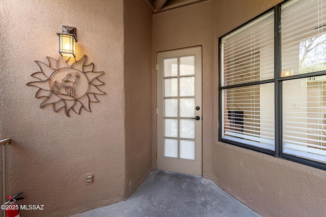 doorway featuring concrete flooring and a healthy amount of sunlight