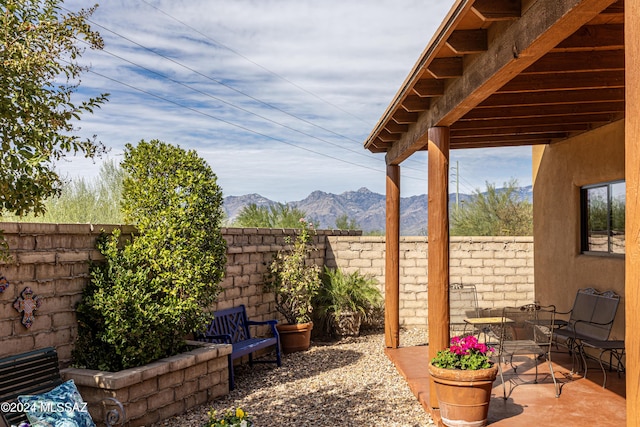 view of patio / terrace with a mountain view