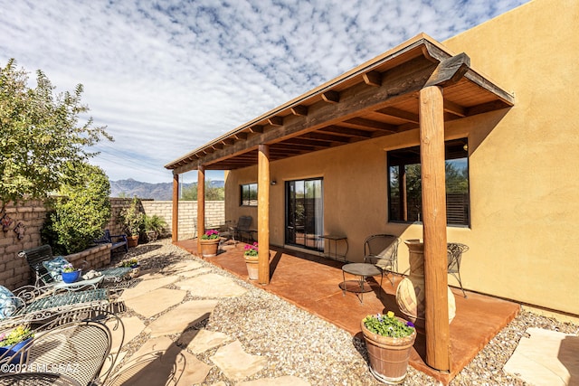 view of patio / terrace with a mountain view