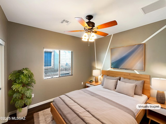 bedroom with dark wood-type flooring and ceiling fan