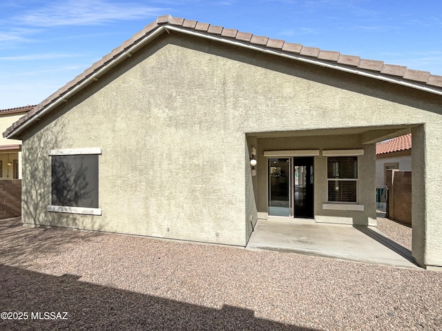 back of house featuring a patio area