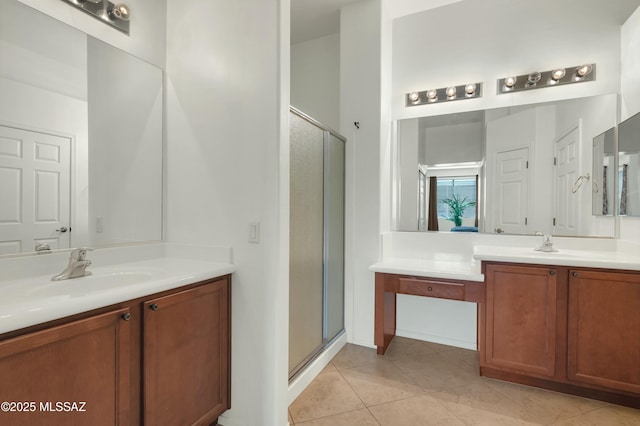 bathroom featuring vanity, tile patterned floors, and a shower with shower door