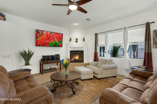 living room featuring carpet floors and ceiling fan