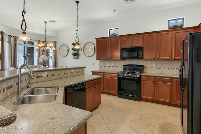 kitchen featuring light tile patterned flooring, sink, decorative light fixtures, decorative backsplash, and black appliances