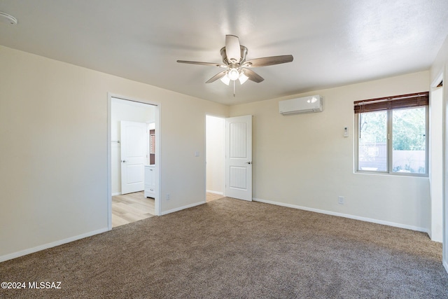 unfurnished room featuring ceiling fan, light colored carpet, and an AC wall unit