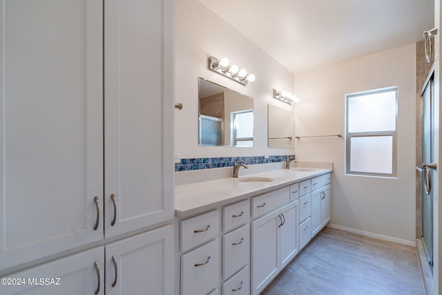 bathroom with vanity and an enclosed shower