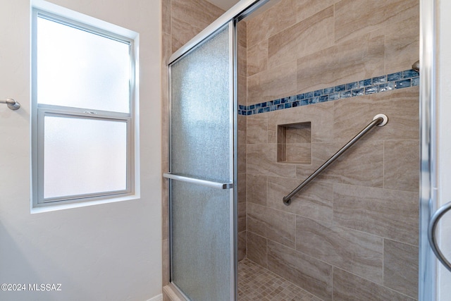 bathroom featuring an enclosed shower