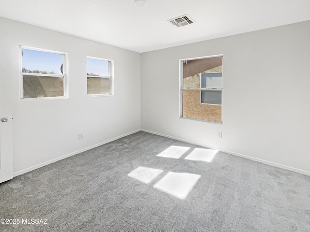 unfurnished room featuring carpet floors