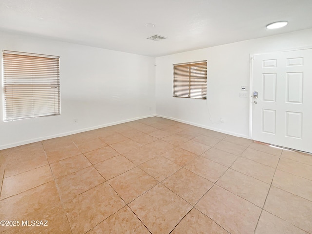 spare room with light tile patterned floors