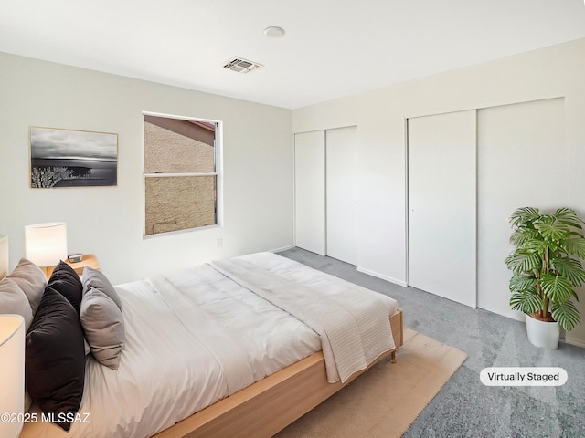 bedroom featuring two closets