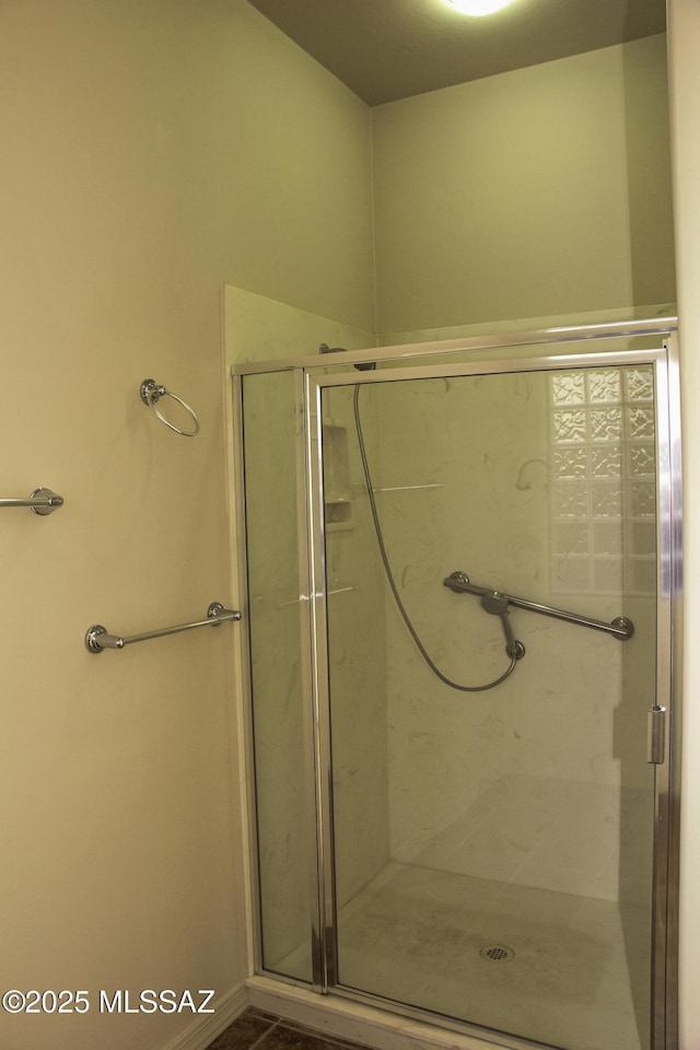 bathroom featuring an enclosed shower