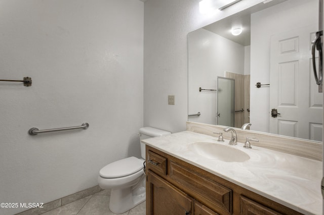 bathroom with tile patterned floors, toilet, and vanity