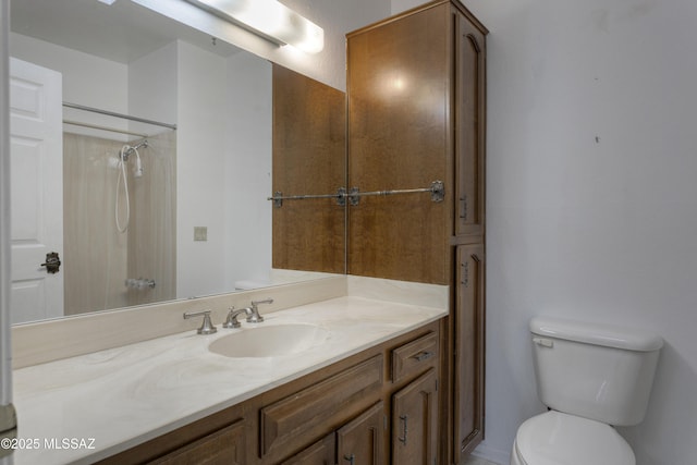 bathroom featuring vanity, toilet, and walk in shower