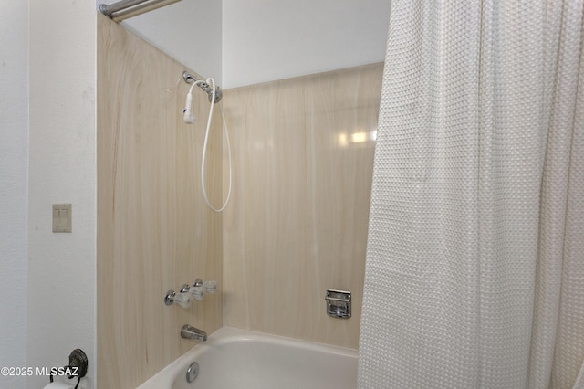 bathroom featuring shower / bathtub combination with curtain