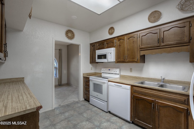 kitchen with sink and white appliances