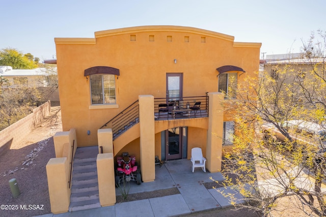 exterior space featuring a balcony and a patio area