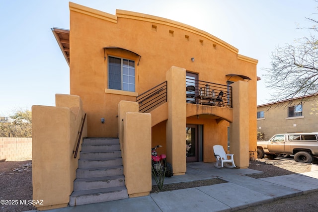 view of front of house with a balcony