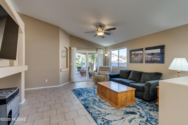 living room featuring lofted ceiling, light tile patterned floors, and ceiling fan