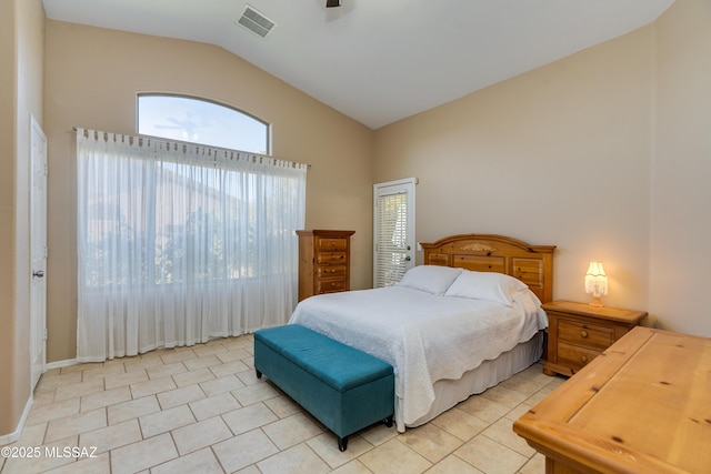 bedroom featuring lofted ceiling and light tile patterned floors