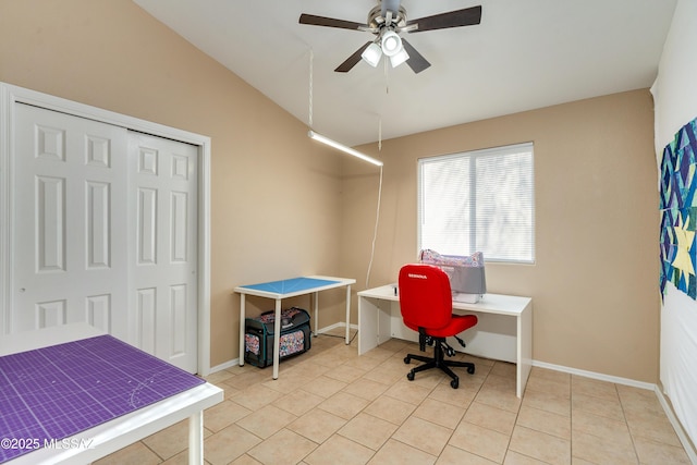 tiled office space with lofted ceiling and ceiling fan