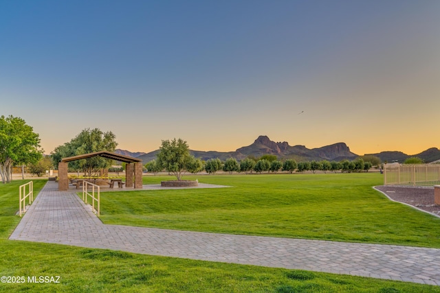 view of community with a gazebo, a mountain view, and a lawn