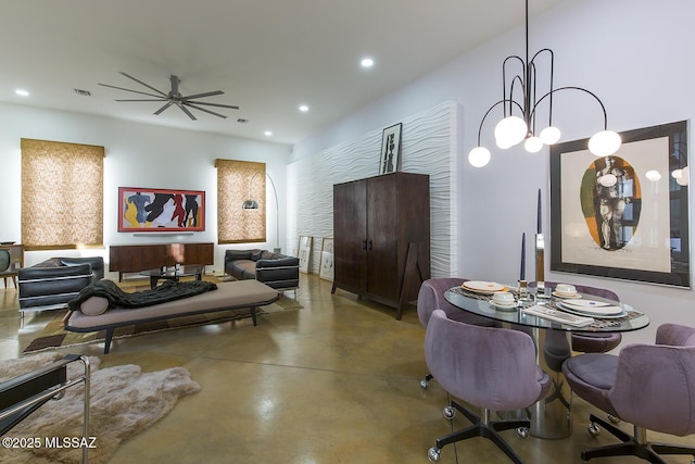 dining space with concrete flooring and ceiling fan