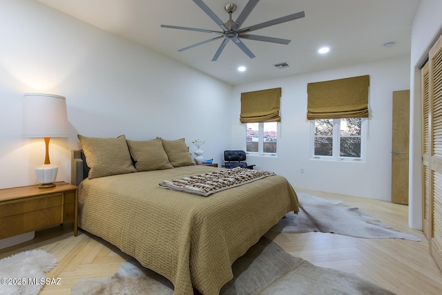 bedroom featuring light parquet floors and ceiling fan