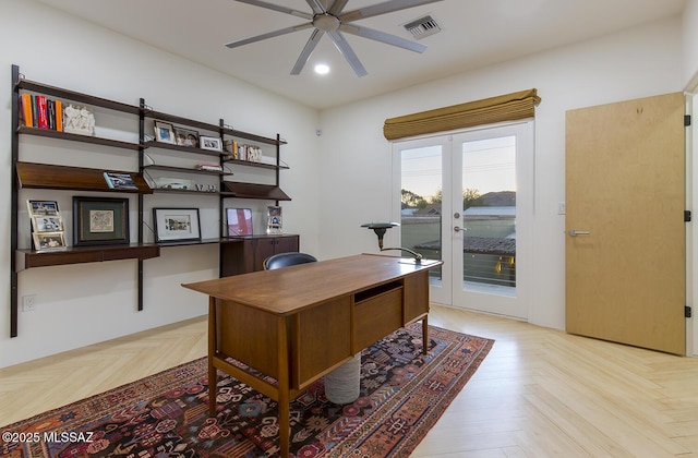 office area with light parquet flooring, ceiling fan, and french doors