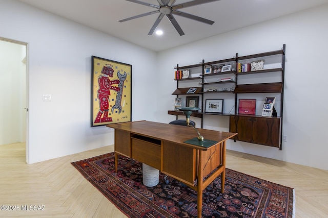 home office with ceiling fan and light parquet flooring