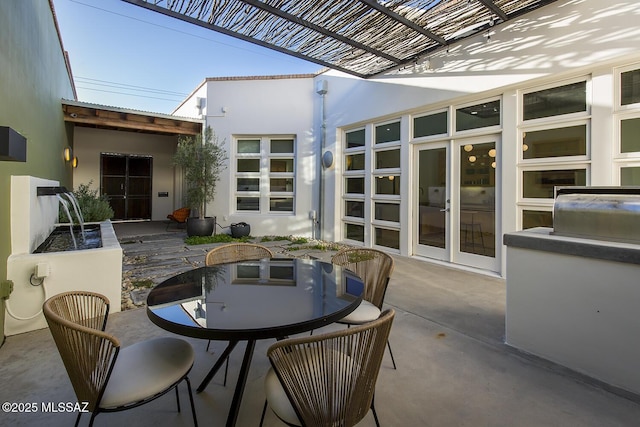 view of patio with a grill