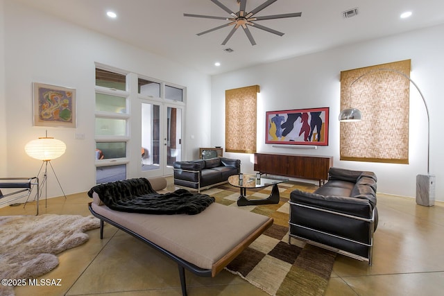 living room featuring french doors and ceiling fan