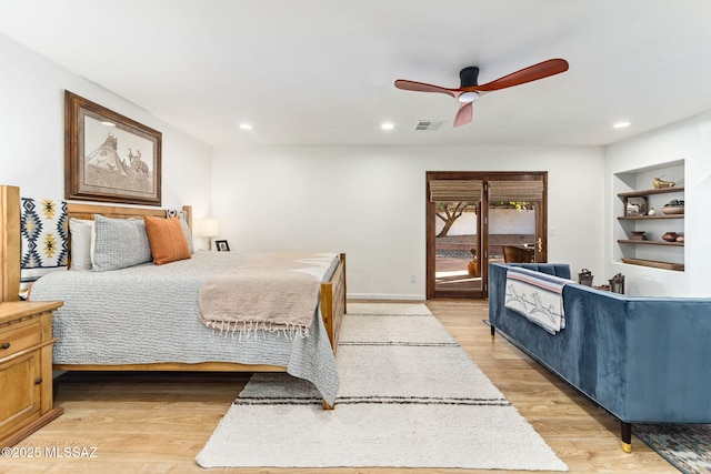 bedroom with ceiling fan, light hardwood / wood-style flooring, and access to outside