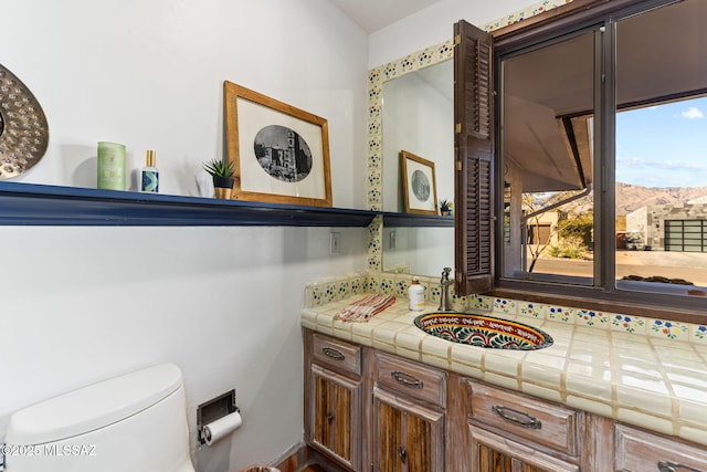 bathroom with vanity and toilet