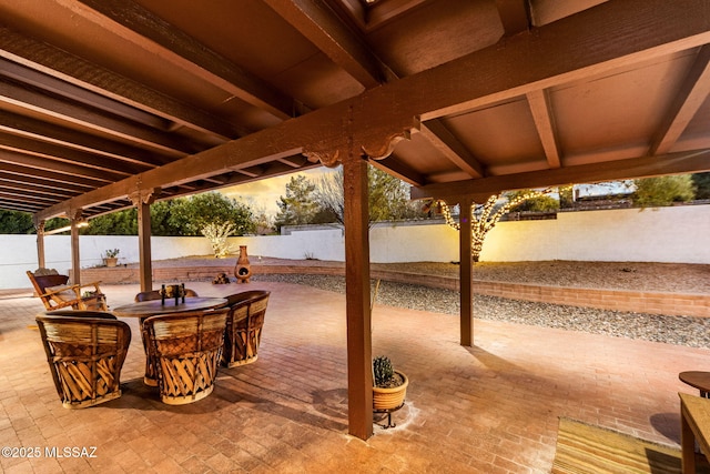 view of patio terrace at dusk