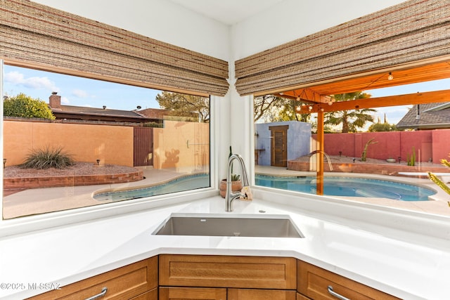 interior space with a hot tub and sink