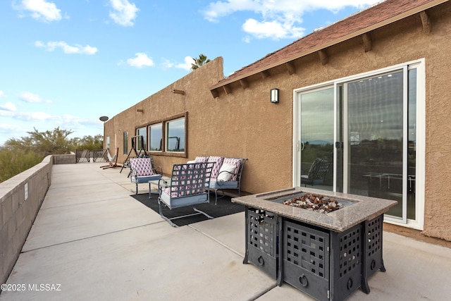 1061 W Roller Coaster Rd, Tucson, AZ 85704 - view of patio with an outdoor living space with a fire pit