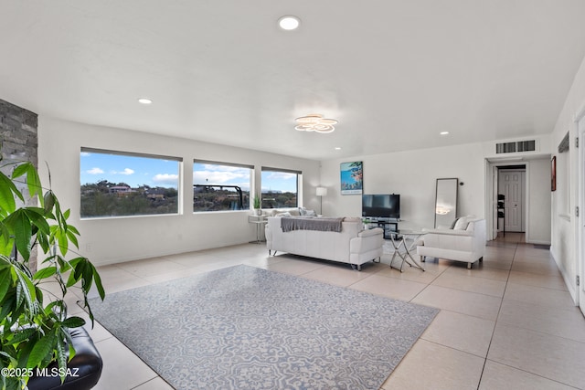 1061 W Roller Coaster Rd, Tucson, AZ 85704 - living room with light tile patterned floors, visible vents, and recessed lighting