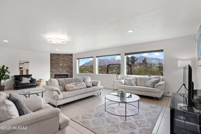 1061 W Roller Coaster Rd, Tucson, AZ 85704 - living area with light tile patterned flooring, recessed lighting, a fireplace, and baseboards