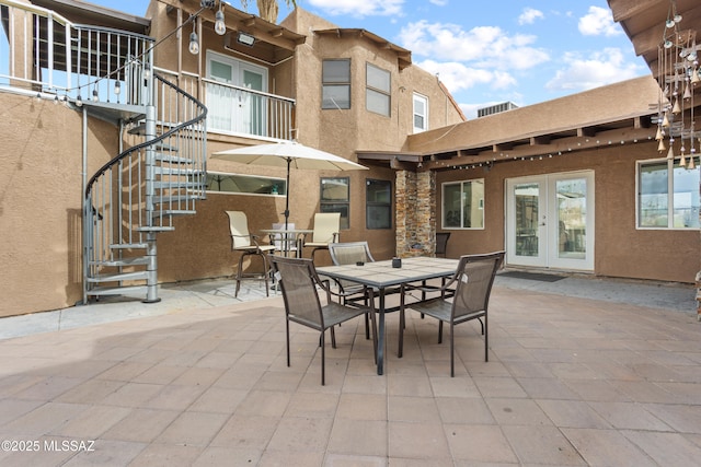 1061 W Roller Coaster Rd, Tucson, AZ 85704 - view of patio with stairway, outdoor dining area, and french doors