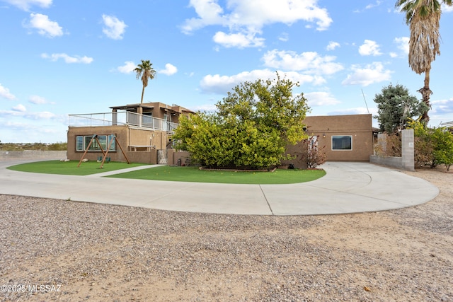 1061 W Roller Coaster Rd, Tucson, AZ 85704 - view of front of house featuring stucco siding and curved driveway
