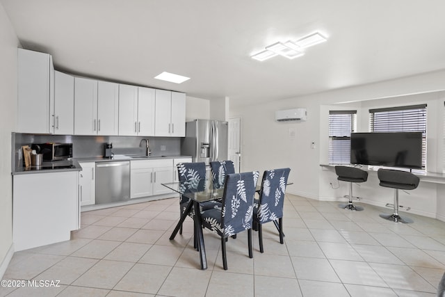 1061 W Roller Coaster Rd, Tucson, AZ 85704 - dining room featuring light tile patterned floors, baseboards, and a wall mounted air conditioner