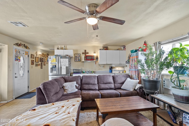 1061 W Roller Coaster Rd, Tucson, AZ 85704 - living room with visible vents, a textured ceiling, and ceiling fan