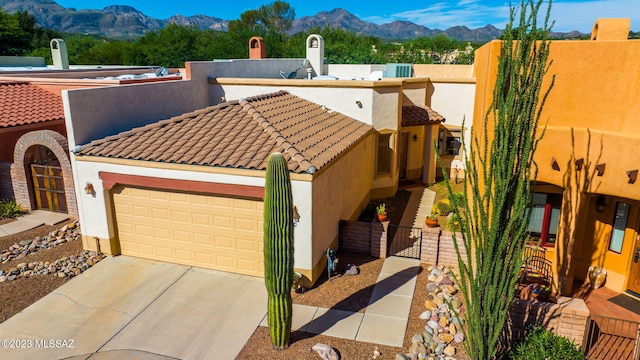 view of front of house featuring a mountain view and a garage