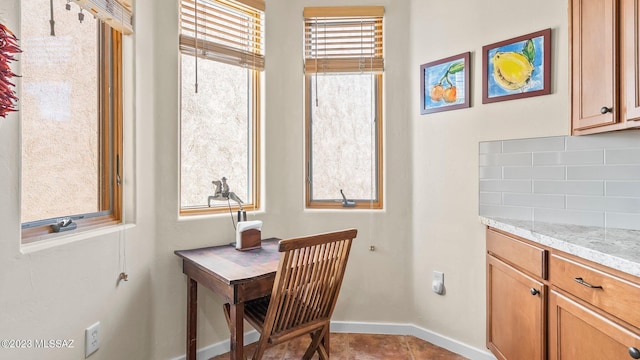 dining area with a wealth of natural light and light tile patterned floors