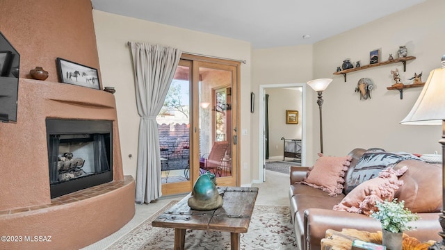 carpeted living room featuring a fireplace