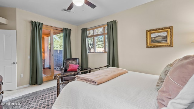 carpeted bedroom with ceiling fan and access to exterior