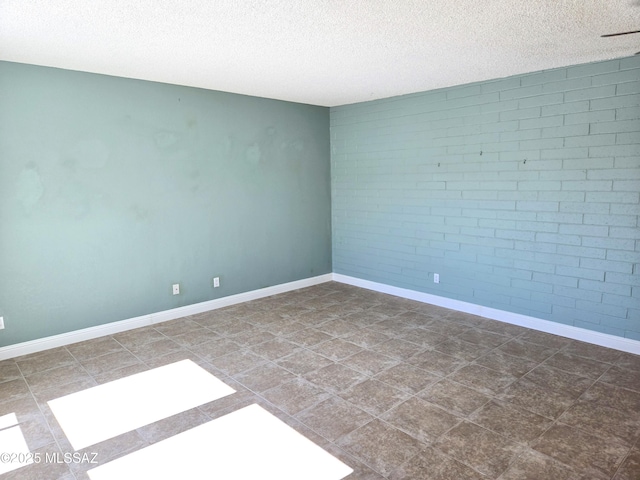 290 N Paseo De Los Conquistadores, Green Valley, AZ 85614 - empty room featuring a textured ceiling and baseboards