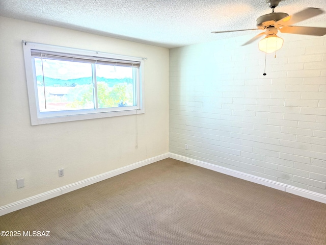 290 N Paseo De Los Conquistadores, Green Valley, AZ 85614 - carpeted empty room featuring plenty of natural light, ceiling fan, a textured ceiling, and baseboards