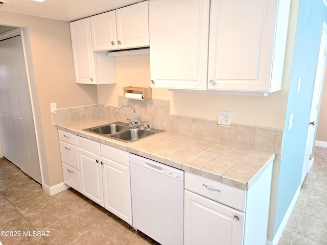 290 N Paseo De Los Conquistadores, Green Valley, AZ 85614 - kitchen featuring dishwasher, a sink, baseboards, white cabinets, and tile countertops